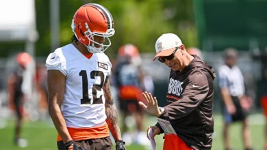 Jul 29, 2026; Berea, OH, USA; Cleveland Browns head coach Todd Monken talks to wide receiver Denzel Boston (12) during training camp at CrossCountry Mortgage Ca…