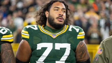 GREEN BAY, WISCONSIN - NOVEMBER 10: Jordan Morgan #77 of the Green Bay Packers looks on during the national anthem prior to an NFL football game against the Phi…