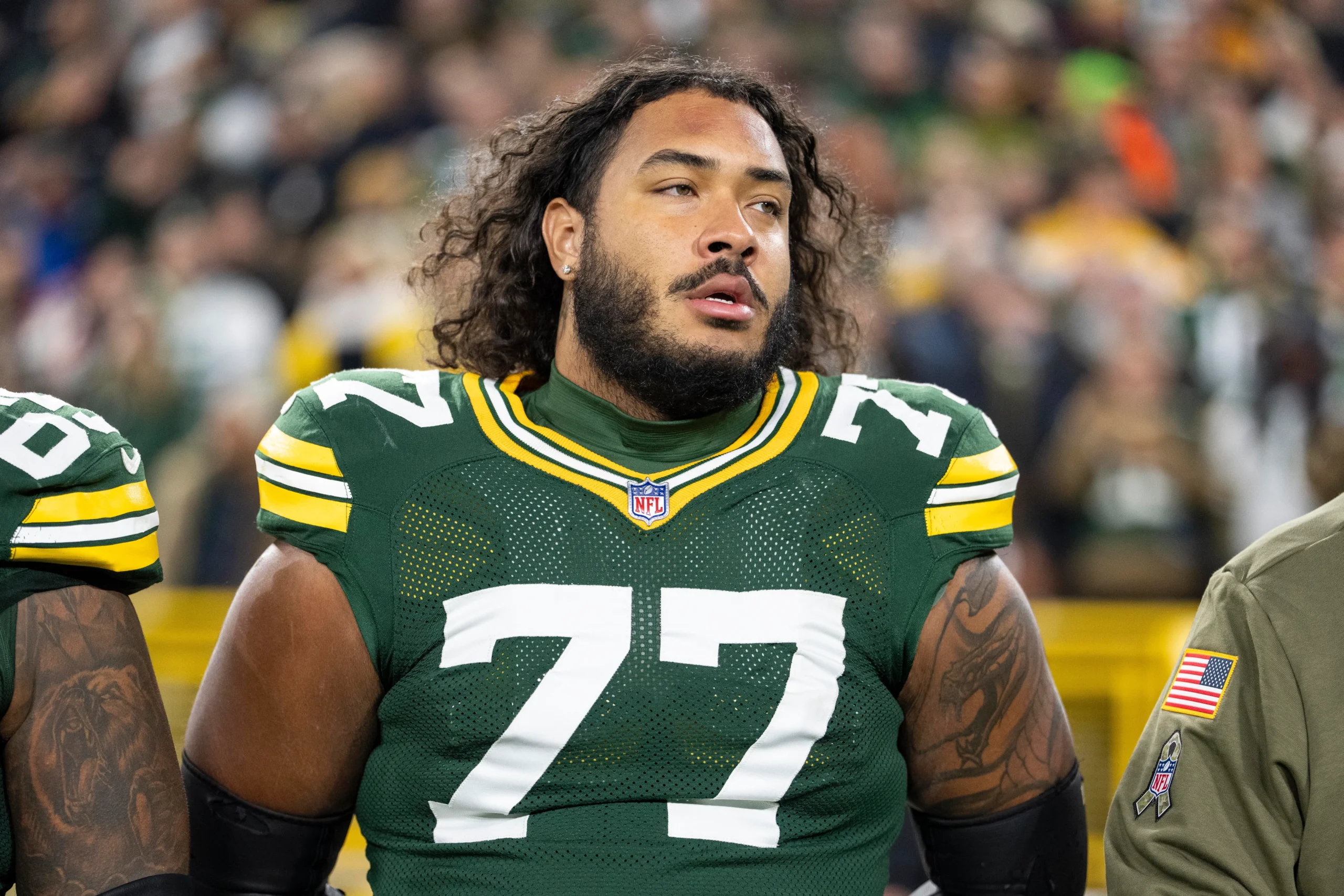 GREEN BAY, WISCONSIN - NOVEMBER 10: Jordan Morgan #77 of the Green Bay Packers looks on during the national anthem prior to an NFL football game against the Phi…