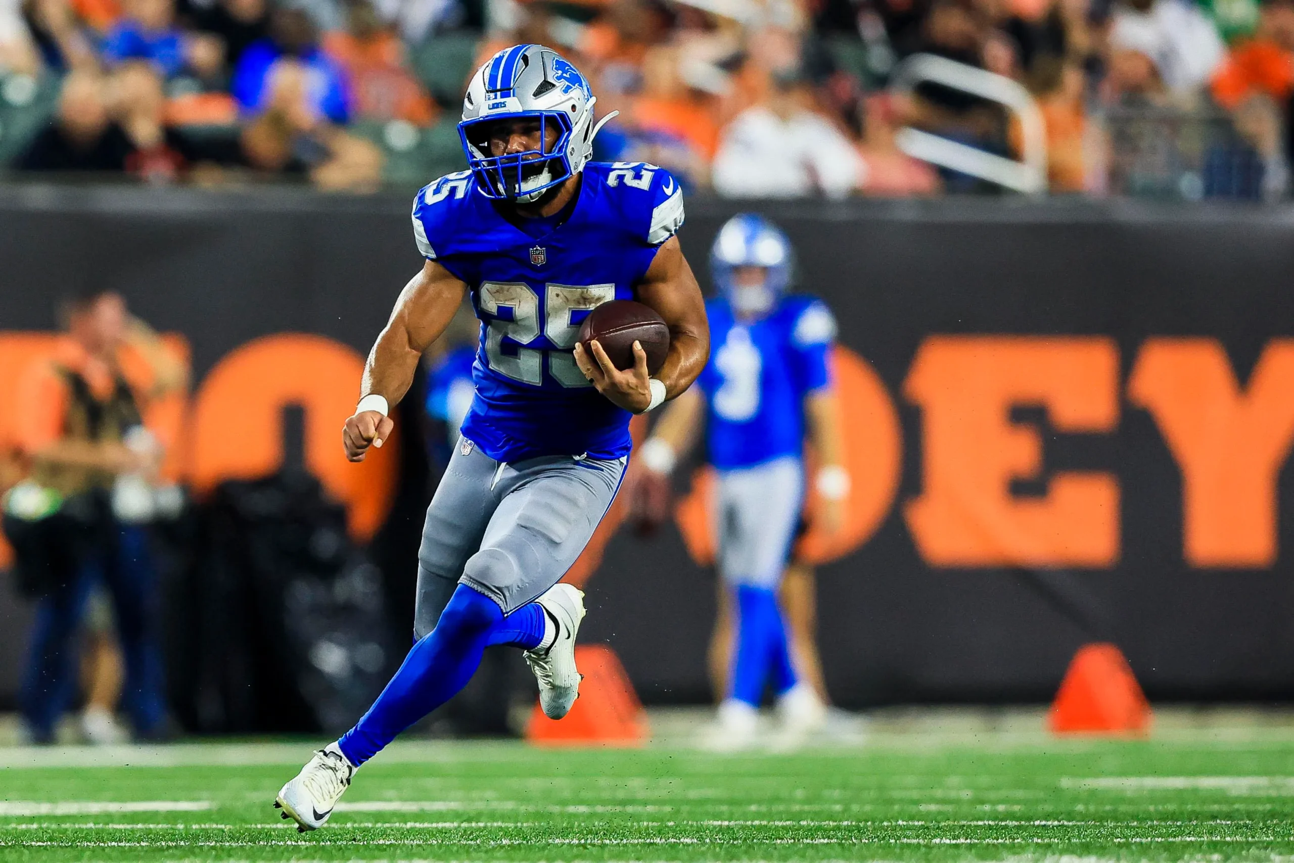 Aug 13, 2026; Cincinnati, Ohio, USA; Detroit Lions running back Jacob Saylors (25) runs with the ball against the Cincinnati Bengals in the first half at Paycor…